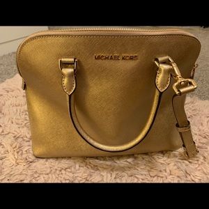 Brand new never used Michael Kors gold purse!